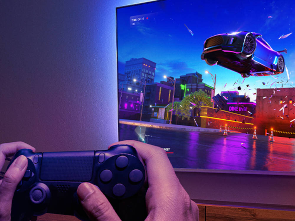 PHILIPS 43PUS9060 czterem złączom HDMI 2.1 technologii VRR Tryb niskiego opóźnienia automatycznie - kontroler na tle telewizora