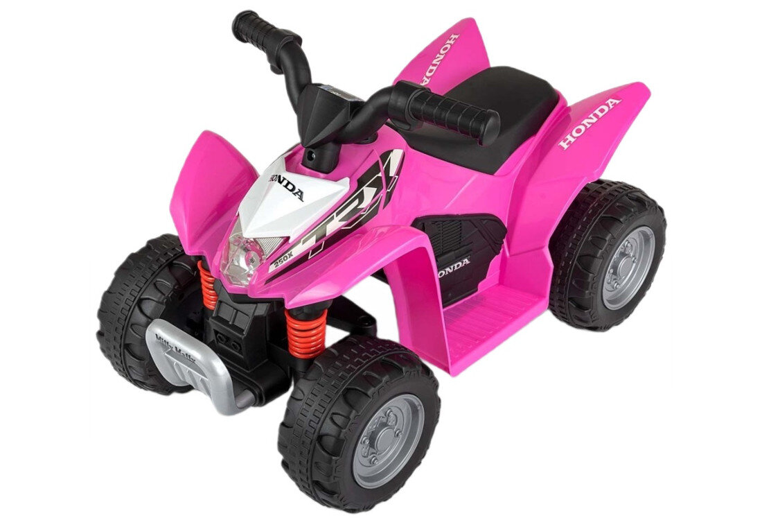 Różowy quad elektryczny dla dzieci z czterema dużymi kołami i czarnym siedzeniem. Na pojeździe widoczne są napisy \'HONDA\' oraz \'TRX\'.