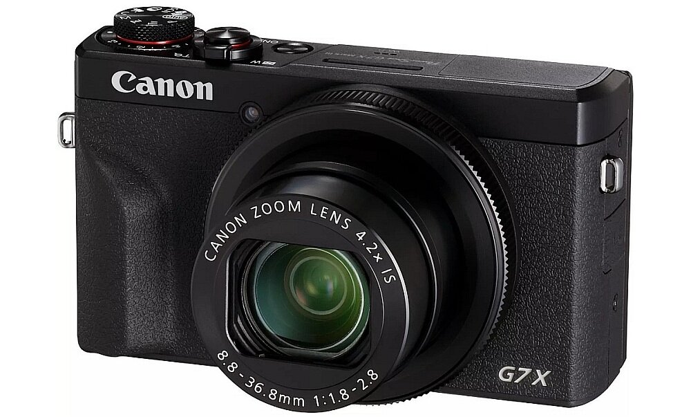 Czarny aparat fotograficzny z widocznym logo \'Canon\' oraz napisem na obiektywie \'CANON ZOOM LENS 4.2x IS\'.