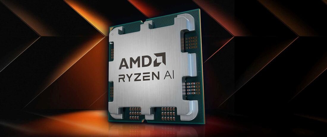 Obraz przedstawia procesor z napisem \'AMD RYZEN AI\' na tle geometrycznych kształtów w ciemnych kolorach.