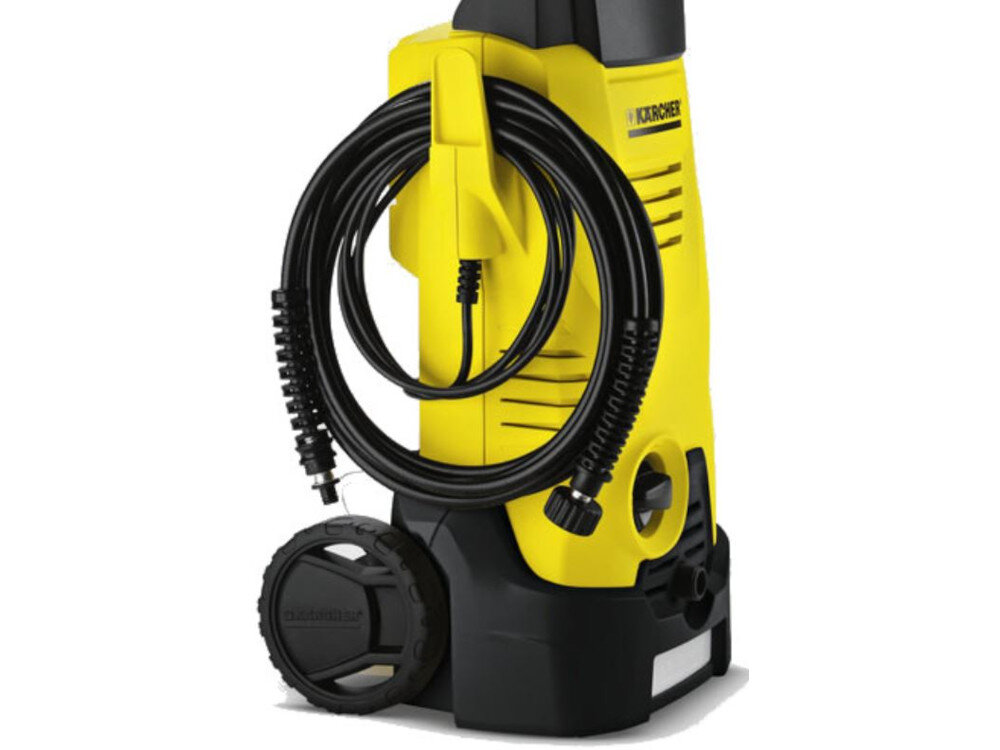 Żółta myjka ciśnieniowa z czarnymi elementami, w tym wężem nawiniętym na uchwyt. Widoczne logo \'KARCHER\' na górnej części urządzenia.