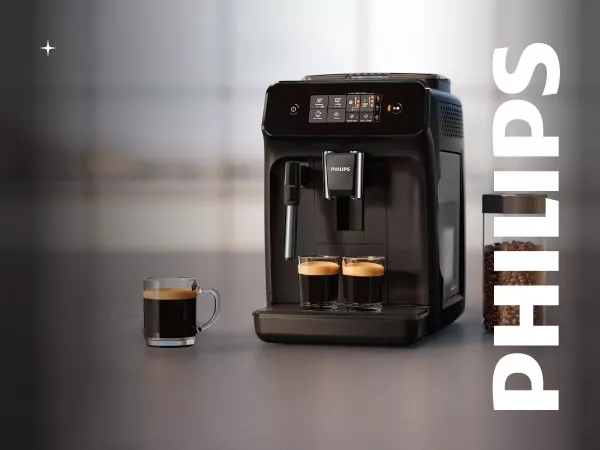 Na obrazie widoczny jest czarny ekspres do kawy z logo PHILIPS, obok którego stoją dwie filiżanki z kawą i szklanka. W tle znajduje się napis PHILIPS oraz słoik z ziarnami kawy.