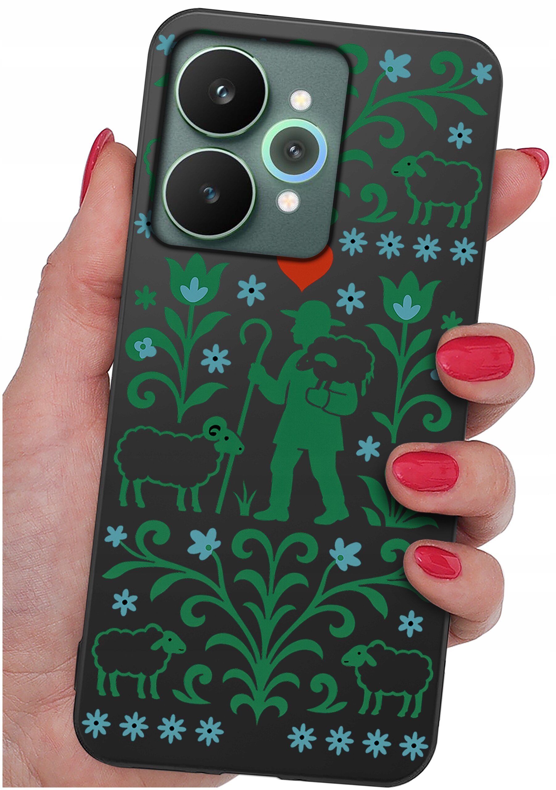 Etui na telefon z motywem pasterza, owiec i kwiatów w zielonych i niebieskich kolorach, trzymane w dłoni z czerwonymi paznokciami.