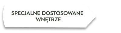 Obraz przedstawia biały prostokąt z czarnym tekstem: \'SPECJALNE DOSTOSOWANE WNĘTRZE\'.
