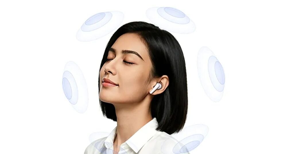 Słuchawki dokanałowe VIVO Buds Pro ANC dźwięk przestrzenny immersyjne audio, osoba z założonymi słuchawkami otoczona dźwiekiem