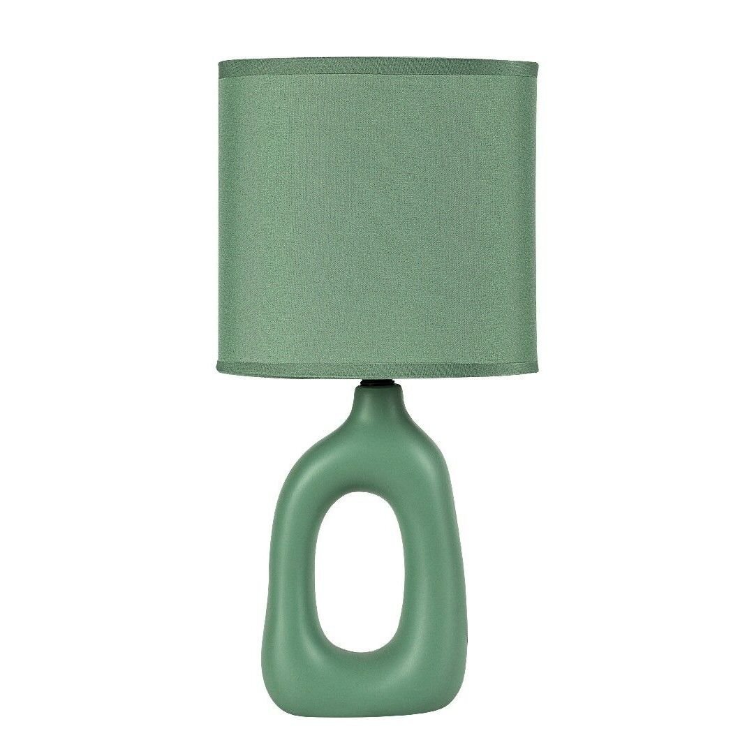 Lampa nocna z zielonym abażurem i podstawą o nowoczesnym, owalnym kształcie. Całość utrzymana w jednolitym zielonym kolorze.