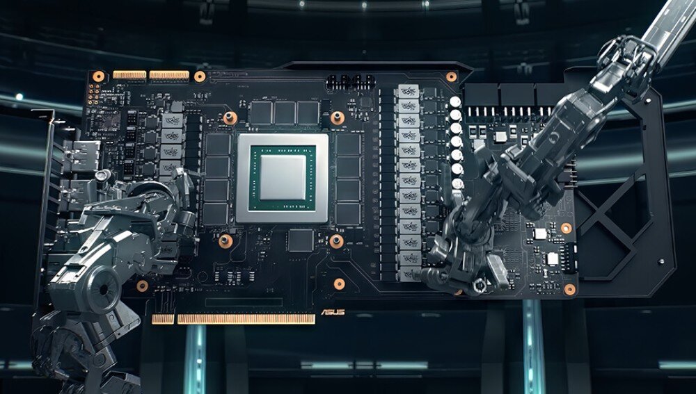 Obraz przedstawia kartę graficzną z widocznymi elementami elektronicznymi i dwoma mechanicznymi ramionami. Na karcie znajduje się logo ASUS.