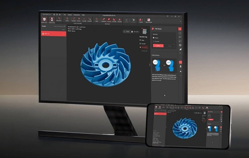 Na ekranie monitora i smartfona wyświetlony jest niebieski model 3D turbiny w programie do projektowania. Interfejs programu zawiera różne narzędzia i opcje edycji po lewej stronie.
