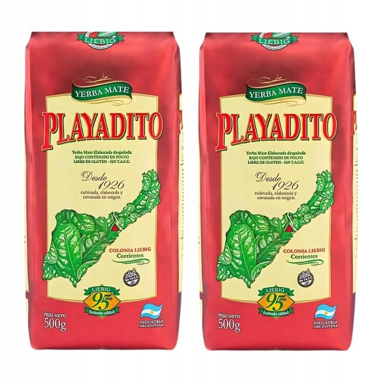 Dwa opakowania Yerba Mate Playadito o wadze netto 500g każde, z zielonym liściem na żółtym tle i czerwonym napisem \'PLAYADITO\'. Widoczne są również napisy \'Desde 1926\', \'Colonia Liebig Corrientes\' oraz logo \'Industria Argentina\'.