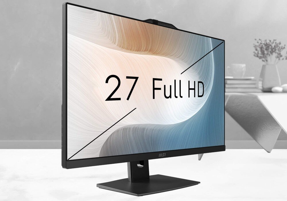 Monitor komputerowy z napisem \'27 Full HD\' na ekranie, umieszczony na biurku w minimalistycznym wnętrzu. Na dolnej ramce widoczne jest logo MSI.