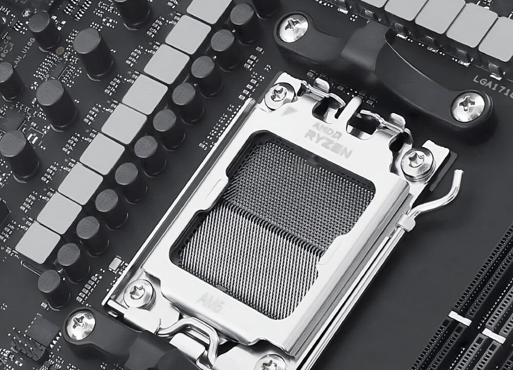 Zbliżenie na gniazdo procesora na płycie głównej z widocznym napisem \'AMD RYZEN\' oraz \'AM5\'.