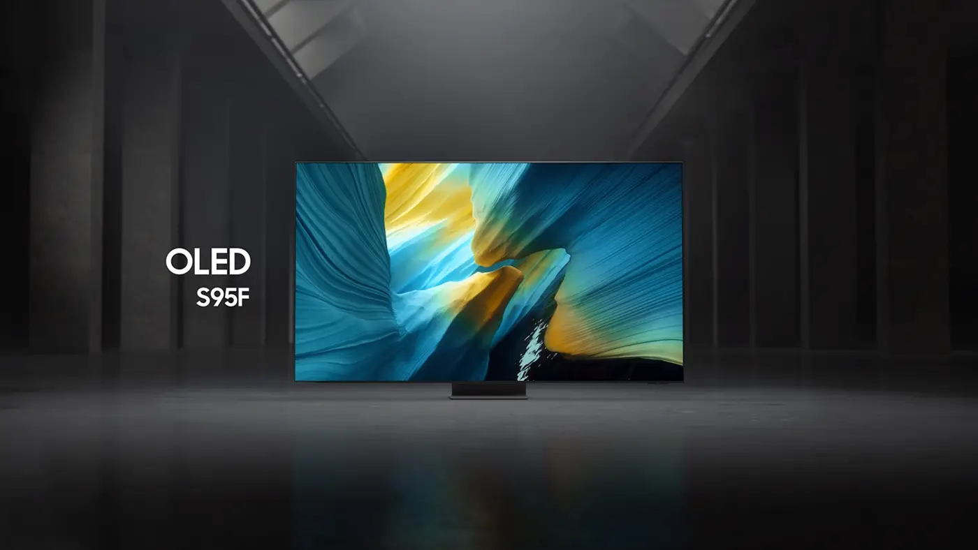 Telewizor z wyświetlaczem OLED prezentuje kolorowy, abstrakcyjny obraz. Obok ekranu widoczny jest napis \'OLED S95F\'.