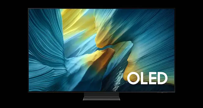 Telewizor z dużym ekranem wyświetlający kolorową grafikę w odcieniach niebieskiego i żółtego. Na ekranie widoczny jest napis \'OLED\'.