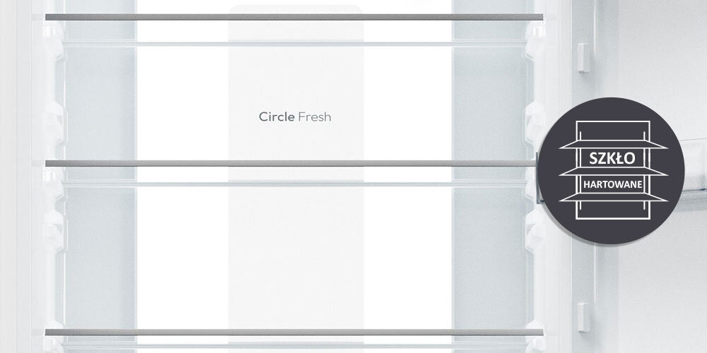 Wnętrze lodówki z półkami i napisem \'Circle Fresh\'. Obok znajduje się okrągła ikona z napisem \'SZKŁO HARTOWANE\'.