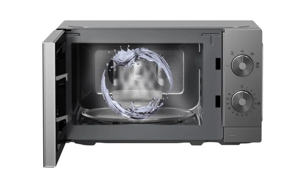KUCHENKA MIKROFALOWA GORENJE MO20A3T4 Otwarta kuchenka mikrofalowa z widoczną komorą, w której pokazano efekt mycia za pomocą wirującego strumienia wody. Po prawej stronie znajdują się dwa pokrętła sterowania AquaClean czyszczenie parą piekarnik bez detergentów łatwe czyszczenie