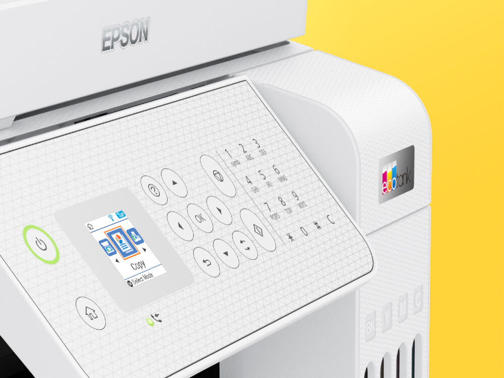 Na obrazie widoczny jest panel sterowania urządzenia wielofunkcyjnego z wyświetlaczem i przyciskami numerycznymi. Logo \'EPSON\' znajduje się na górze, a po prawej stronie widoczny jest napis \'ecotank\'.