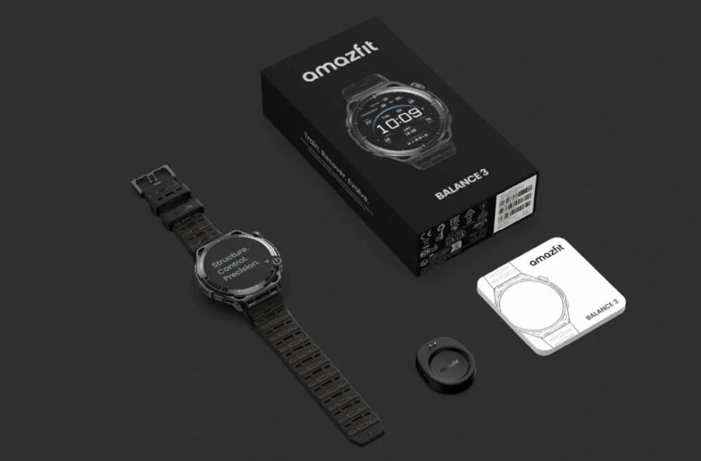 Na obrazie znajduje się smartwatch z metalową bransoletą, pudełko z napisem \'amazfit BALANCE 3\', ładowarka oraz instrukcja obsługi. Na ekranie zegarka widoczny jest tekst: \'Structure Control Predictable\'.