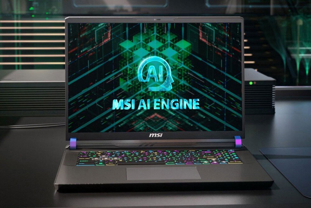 Laptop z logo MSI na obudowie, wyświetlający na ekranie grafikę z napisem \'MSI AI ENGINE\'. Klawiatura jest podświetlana w różnych kolorach.