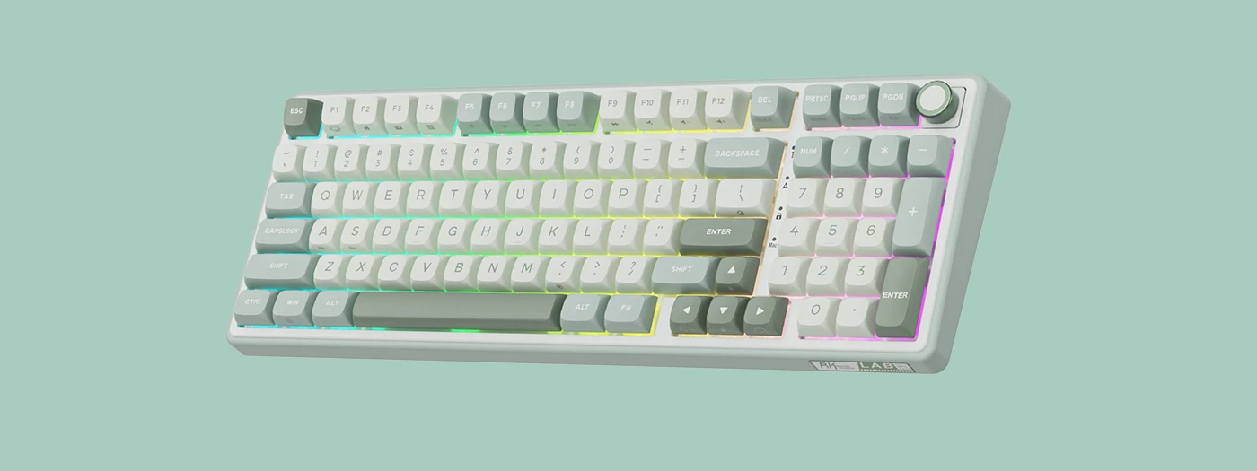Klawiatura mechaniczna z podświetleniem RGB, posiadająca klawisze numeryczne oraz pokrętło w prawym górnym rogu. Na obudowie widoczne jest logo \'RK LAB\'.