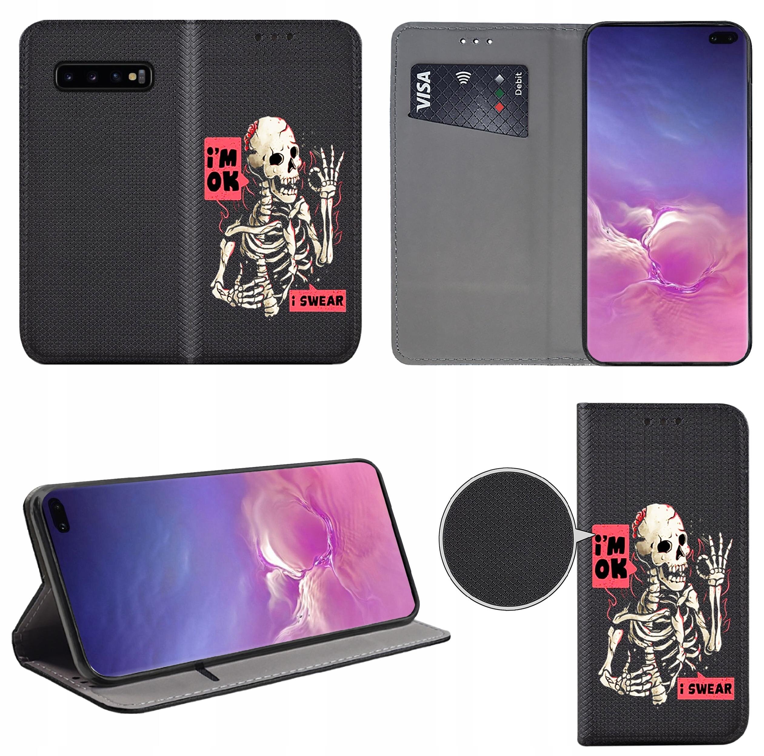 Etui do telefonu z nadrukiem szkieletu i napisami \'i\'m OK\' oraz \'I SWEAR\'. Wewnątrz znajduje się miejsce na kartę płatniczą z widocznym napisem \'VISA Debit\'.