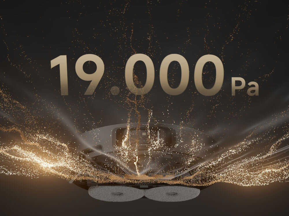 Obraz przedstawia robot sprzątający z efektem wizualnym unoszących się cząsteczek. Na górze widoczny jest tekst \'19.000 Pa\'.