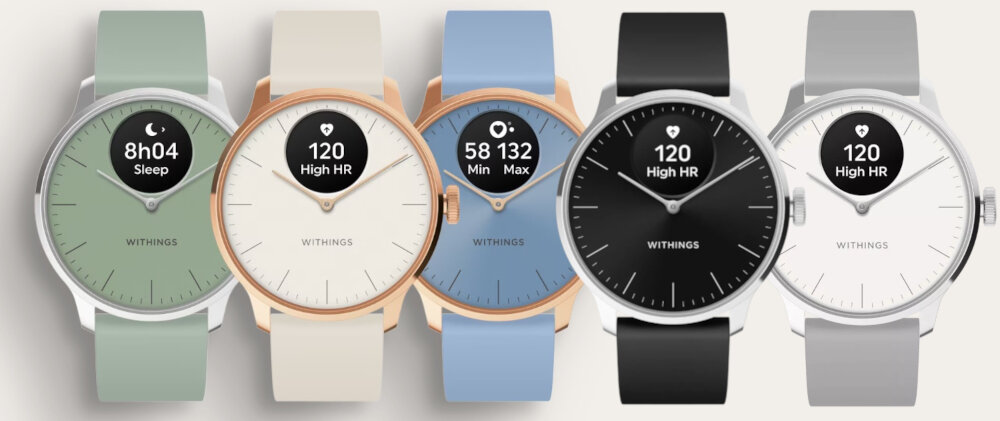 Pięć smartwatchy WITHINGS w różnych kolorach: zielonym, kremowym, niebieskim, czarnym i szarym. Na tarczach widoczne są różne informacje, takie jak \'8h04 Sleep\', \'120 High HR\' oraz \'58 132 Min Max\'.