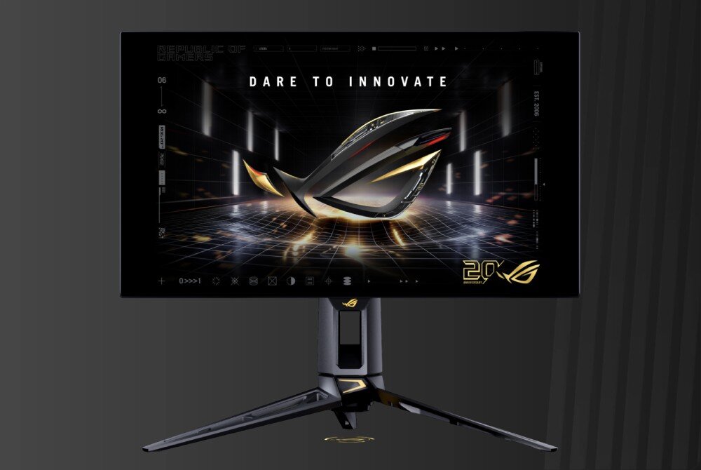 Monitor ASUS ROG Swift PG27AQWP-G Przód monitora na ciemnym tle. Na ekranie widać trójwymiarowe świecące logo przypominające oko i napis 'DARE TO INNOVATE' umieszczony na górze