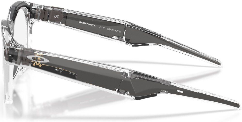 Przezroczyste okulary z ciemnymi zausznikami, na których widnieje napis \'OAKLEY META HSTN\'.