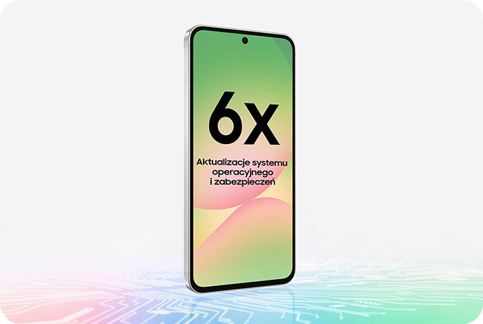 Smartfon z wyświetlaczem pokazującym tekst \'6x Aktualizacje systemu operacyjnego i zabezpieczeń\' na tle gradientu w kolorach zielonym i różowym. Urządzenie stoi na powierzchni z wzorem przypominającym obwody elektroniczne.