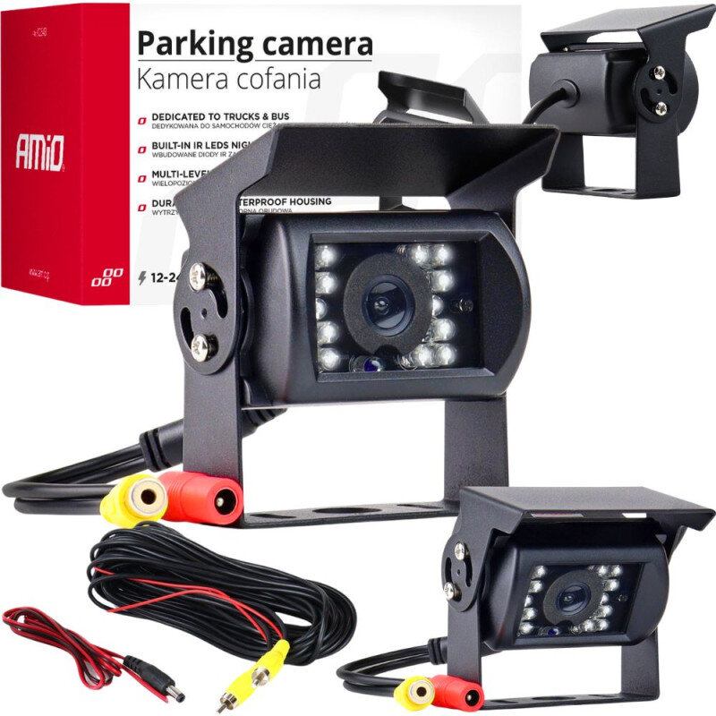 Na obrazie widoczna jest kamera cofania z czarną obudową, otoczona diodami LED. W tle znajduje się pudełko z napisem \'Parking camera Kamera cofania\' oraz logo \'AMiO\'.