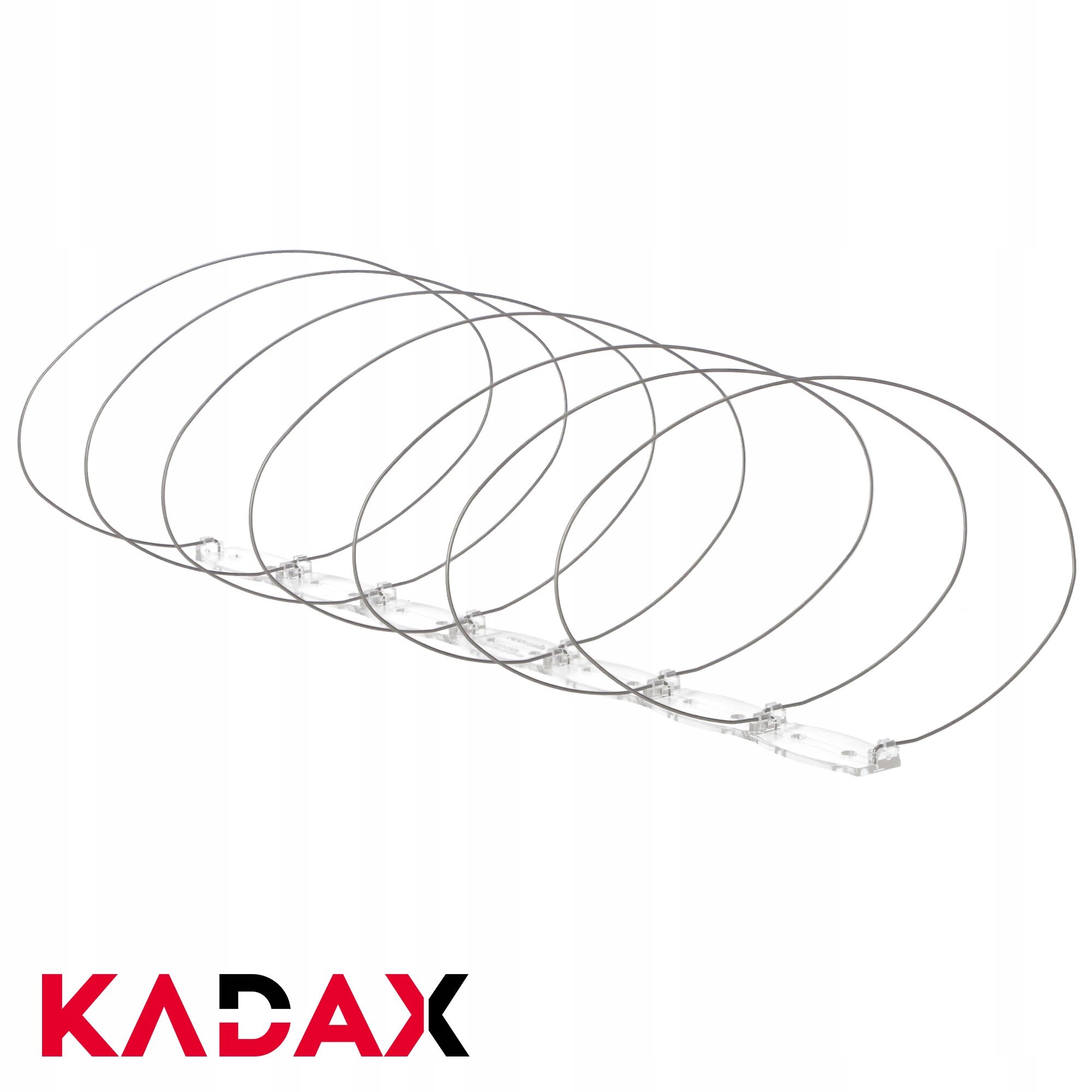 Na obrazie widoczne są metalowe spirale zamontowane na przezroczystej podstawie, służące jako zabezpieczenie przed ptakami. W lewym dolnym rogu znajduje się logo \'KADAX\'.