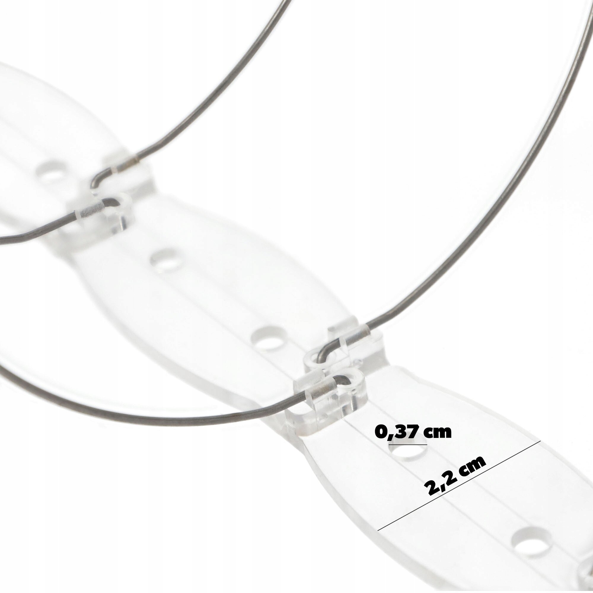 Obraz przedstawia przezroczystą podstawę z przymocowanymi metalowymi spiralami. Widoczne są wymiary: 0,37 cm i 2,2 cm.