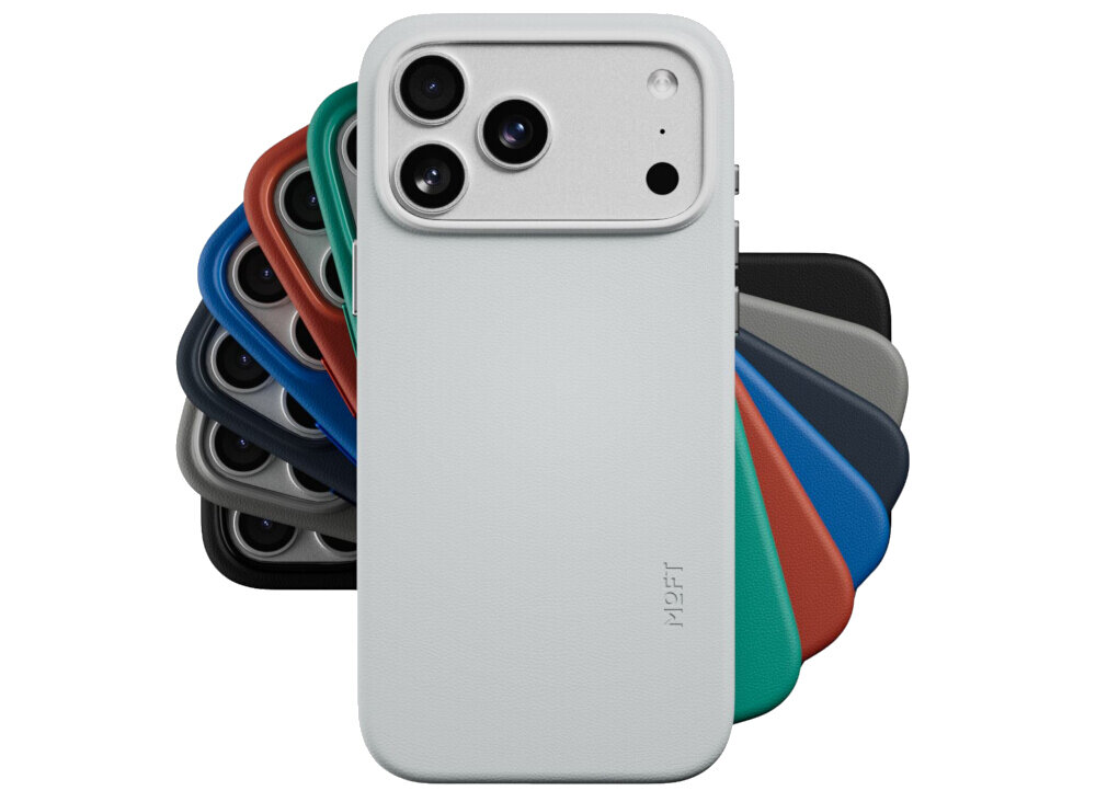 Na obrazie widoczne jest etui na telefon w kolorze beżowo-szarym z trzema otworami na aparaty fotograficzne. W tle znajdują się etui w różnych kolorach, a na pierwszym planie widnieje napis \'MOFT\'.