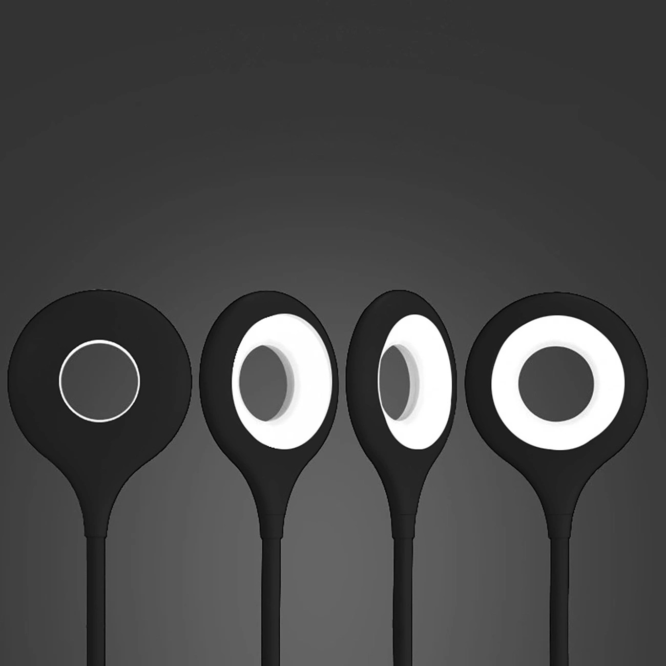 Cztery czarne lampki LED z okrągłymi, białymi źródłami światła na ciemnym tle. Lampki mają elastyczne ramiona i okrągłe głowice.