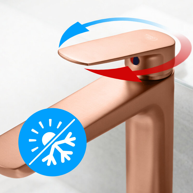 Bateria umywalkowa w kolorze szczotkowanej miedzi z widocznymi symbolami wskazującymi na regulację temperatury wody. Na baterii znajduje się niebiesko-czerwony symbol oraz niebieska ikona z symbolem słońca i płatka śniegu.