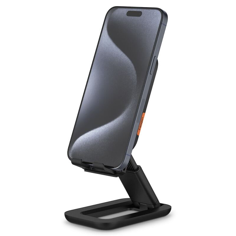 Czarny stojak na telefon z umieszczonym na nim smartfonem. Na stojaku widoczny jest napis \'SPIGEN\'.