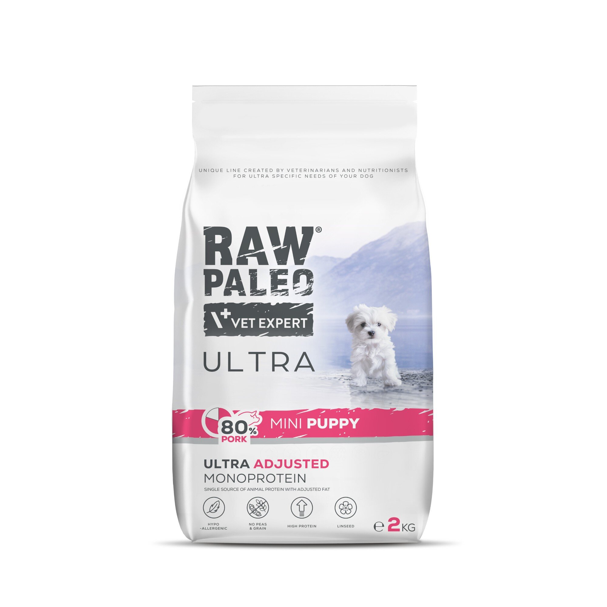 Opakowanie suchej karmy dla szczeniąt z napisem \'RAW PALEO VET EXPERT ULTRA\' oraz \'80% PORK MINI PUPPY\'. Widoczny jest mały pies na tle górskiego krajobrazu, a w dolnej części opakowania znajdują się ikony i napis \'ULTRA ADJUSTED MONOPROTEIN\'.