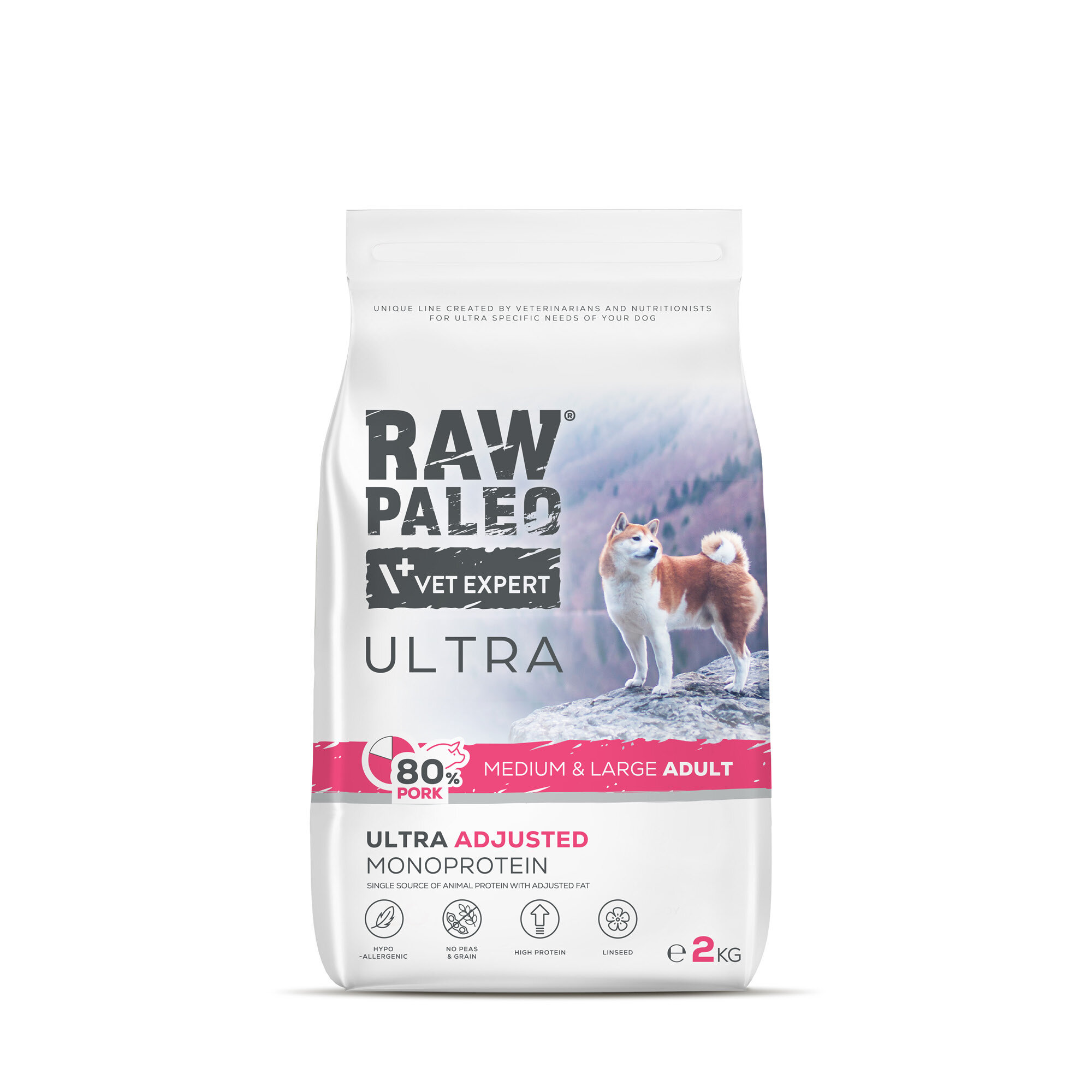 Opakowanie suchej karmy dla psów z napisem \'RAW PALEO VET EXPERT ULTRA\'. Widoczny jest pies na tle gór oraz informacje o składzie: \'80% PORK\', \'MEDIUM & LARGE ADULT\', \'ULTRA ADJUSTED MONOPROTEIN\'.
