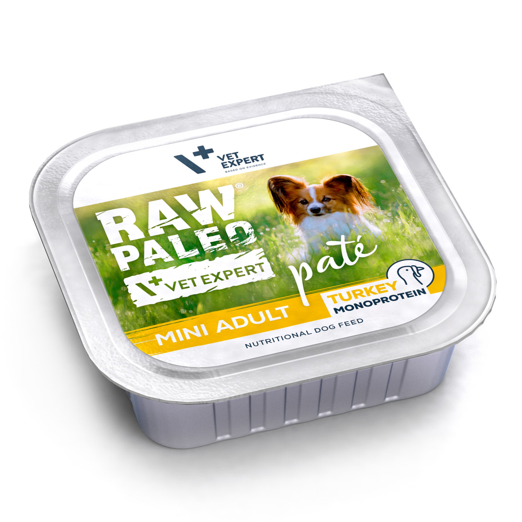 Opakowanie mokrej karmy dla psów z napisem \'RAW PALEO VET EXPERT paté MINI ADULT TURKEY MONOPROTEIN\'. Na etykiecie widoczny jest pies na tle trawy.