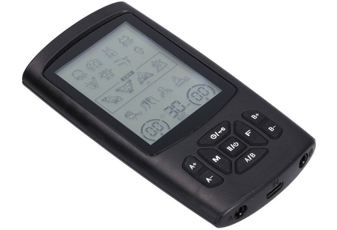 Na zdjęciu widoczny jest czarny elektrostymulator z wyświetlaczem LCD, na którym znajdują się różne ikony i cyfry. Urządzenie posiada kilka przycisków funkcyjnych oznaczonych symbolami i literami, takimi jak A+, A-, B+, B-, M, F, A/B.