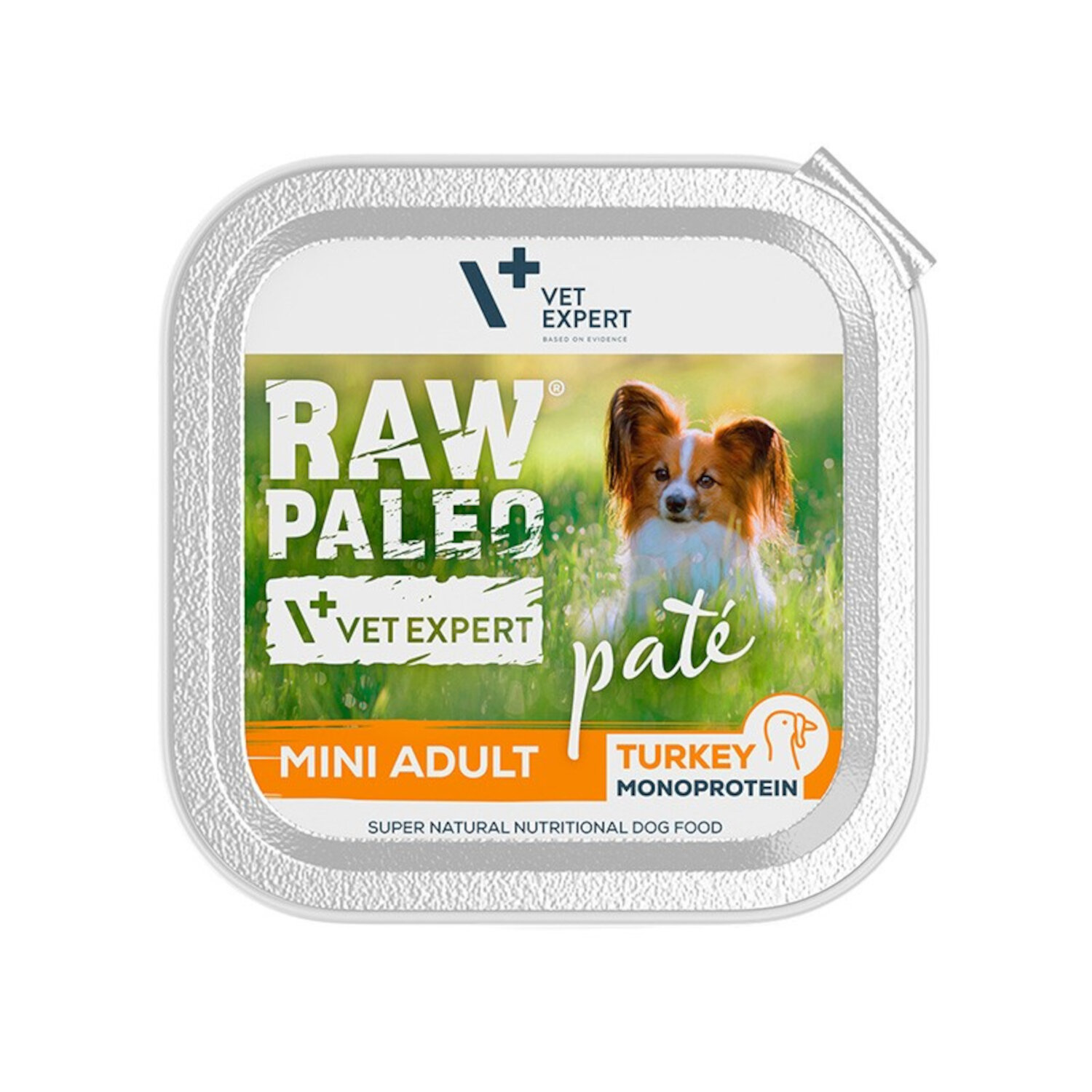 Opakowanie mokrej karmy dla psów z napisem \'RAW PALEO VET EXPERT paté MINI ADULT TURKEY MONOPROTEIN\'. Na etykiecie widoczny jest pies na tle trawy oraz logo \'VET EXPERT\'.