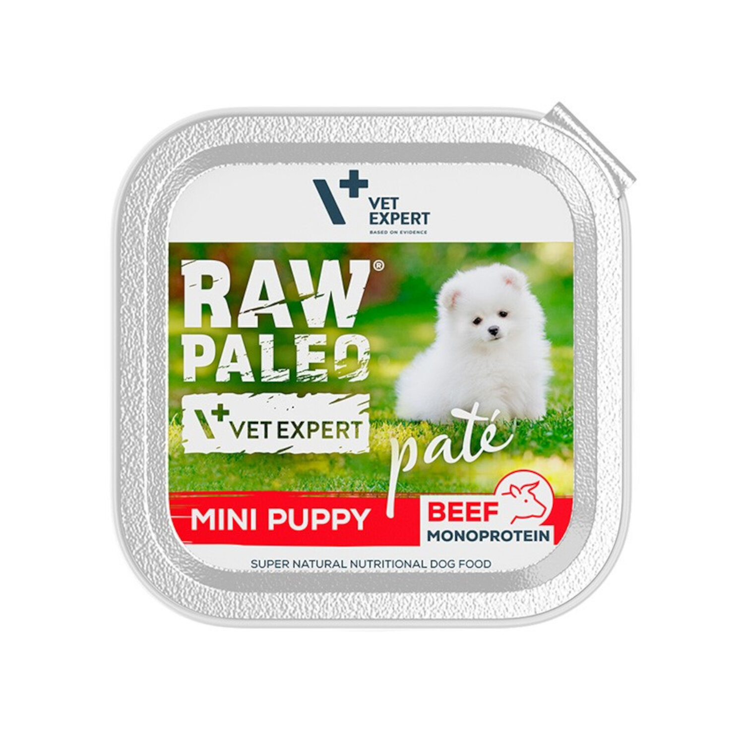 Opakowanie mokrej karmy dla szczeniąt z napisem \'RAW PALEO VET EXPERT pate MINI PUPPY BEEF MONOPROTEIN\'. Na etykiecie widoczny jest biały szczeniak na tle zielonej trawy.