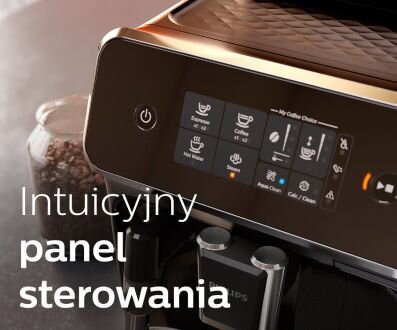 Zdjęcie przedstawia panel sterowania ekspresu do kawy z wyświetlaczem pokazującym różne opcje napojów. Na obrazie widoczny jest napis \'Intuicyjny panel sterowania\'.
