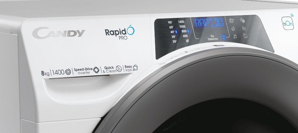 Pralka z widocznym panelem sterowania, na którym znajdują się przyciski i wyświetlacz LED. Na obudowie widoczne są napisy: \'CANDY\', \'RapidÓ PRO\', \'8kg\', \'1400\', \'Speed-Drive Inverter\', \'Quick & Clean\', \'Easy Iron\'.