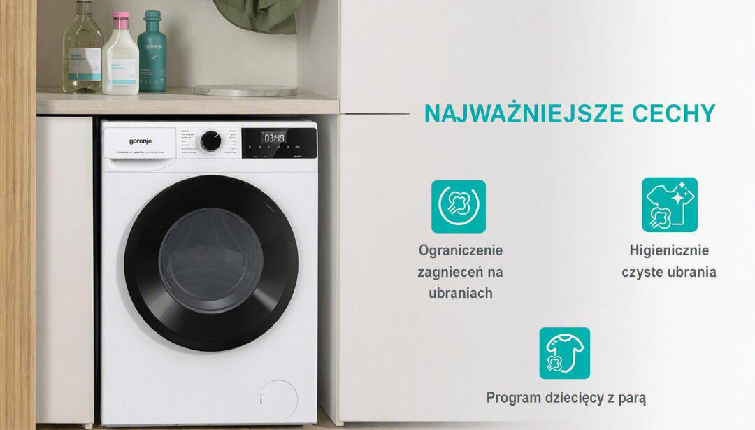 Pralka GORENJE z czarnym okrągłym bębnem i panelem sterowania z wyświetlaczem. Obok widoczny tekst: \'NAJWAŻNIEJSZE CECHY\', \'Ograniczenie zagnieceń na ubraniach\', \'Higienicznie czyste ubrania\', \'Program dziecięcy z parą\'.