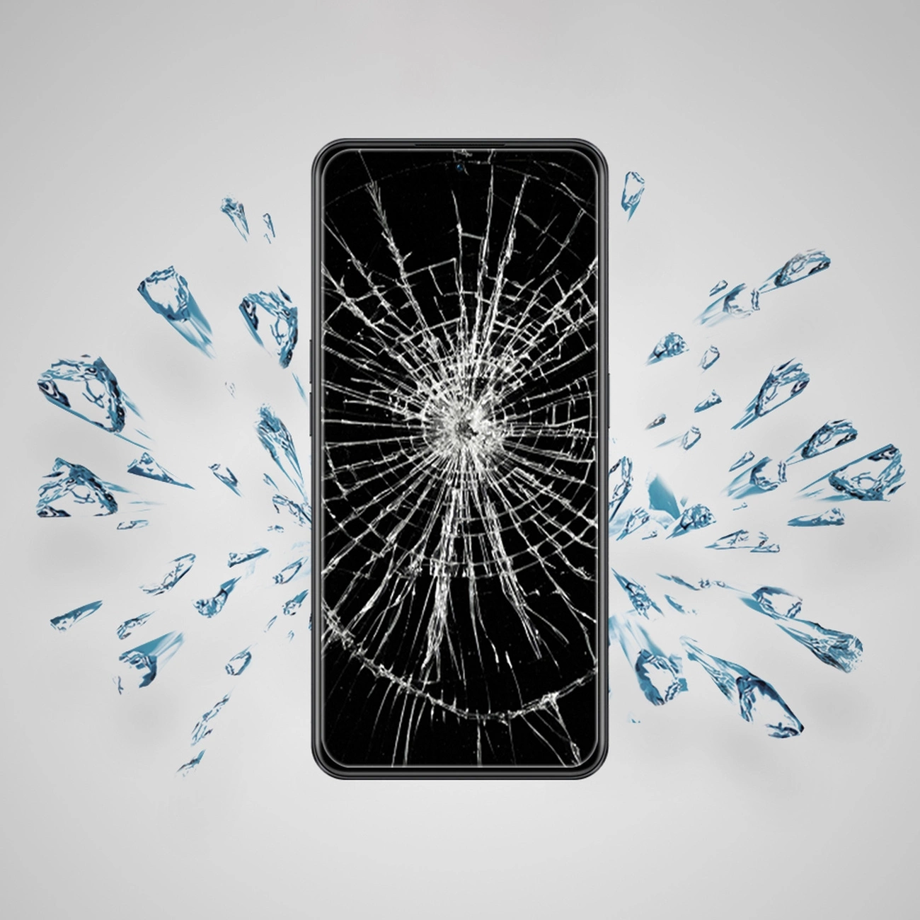 Obraz przedstawia smartfon z pękniętym ekranem, otoczony odłamkami szkła na szarym tle.
