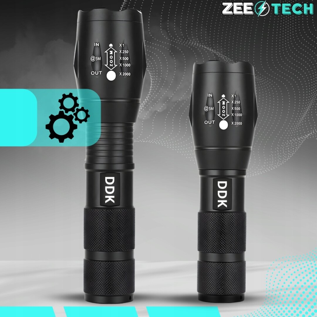 Na obrazie widoczne są dwie czarne latarki z oznaczeniami zoomu i napisem \'DDK\'. W prawym górnym rogu znajduje się logo \'ZEETECH\'.