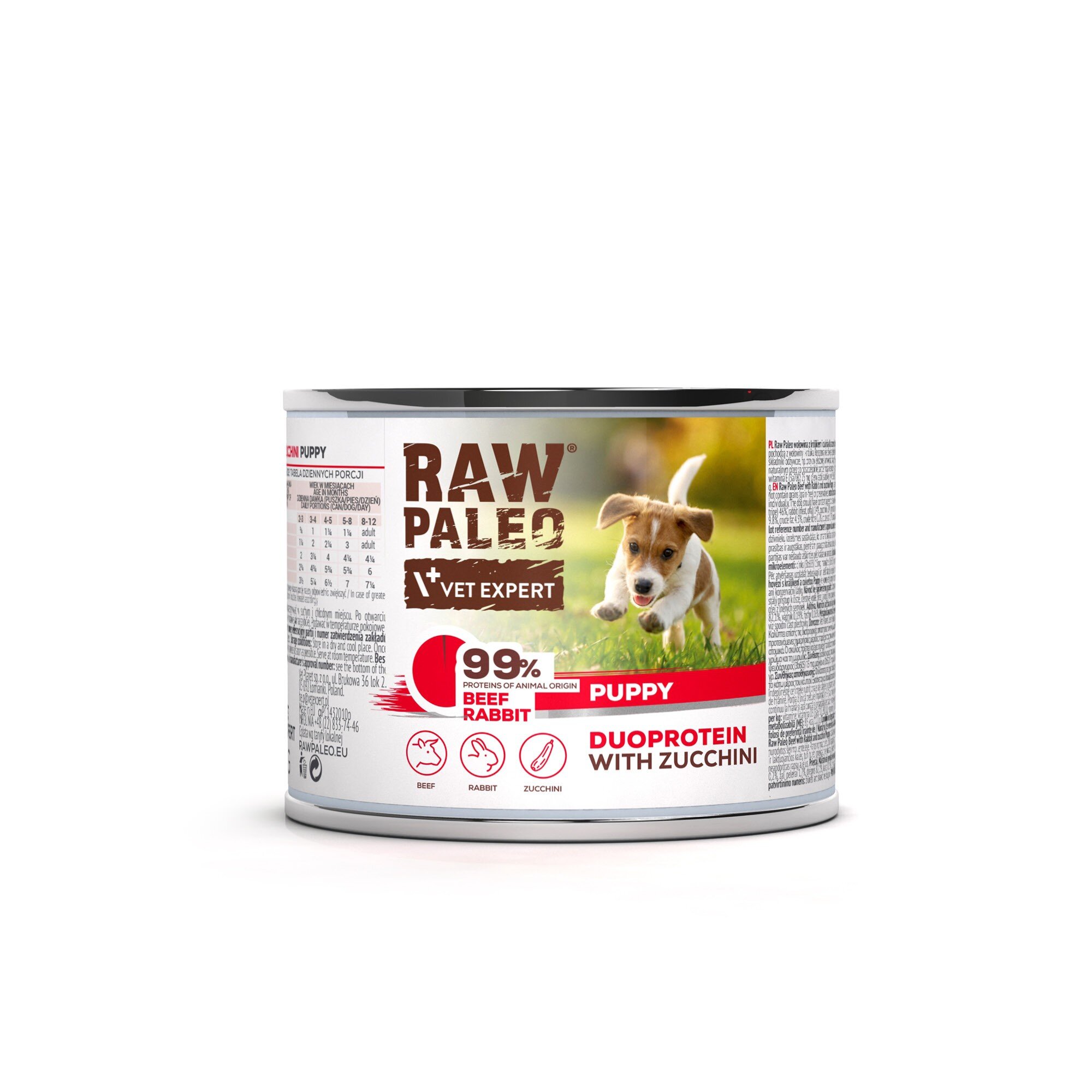 Puszka mokrej karmy dla szczeniąt z etykietą \'RAW PALEO VET EXPERT\' oraz zdjęciem szczeniaka na trawie. Na etykiecie widnieje napis \'99% proteins of animal origin BEEF RABBIT PUPPY DUOPROTEIN WITH ZUCCHINI\'.