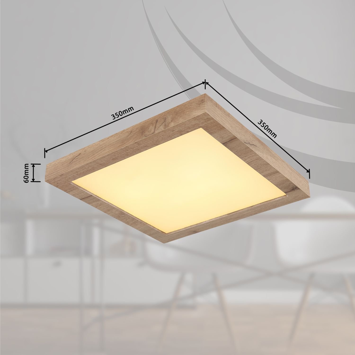 Kwadratowy plafon LED z drewnianą ramą, o wymiarach 350mm x 350mm x 60mm, emituje ciepłe światło. W tle widoczne są zarysy wnętrza mieszkalnego.