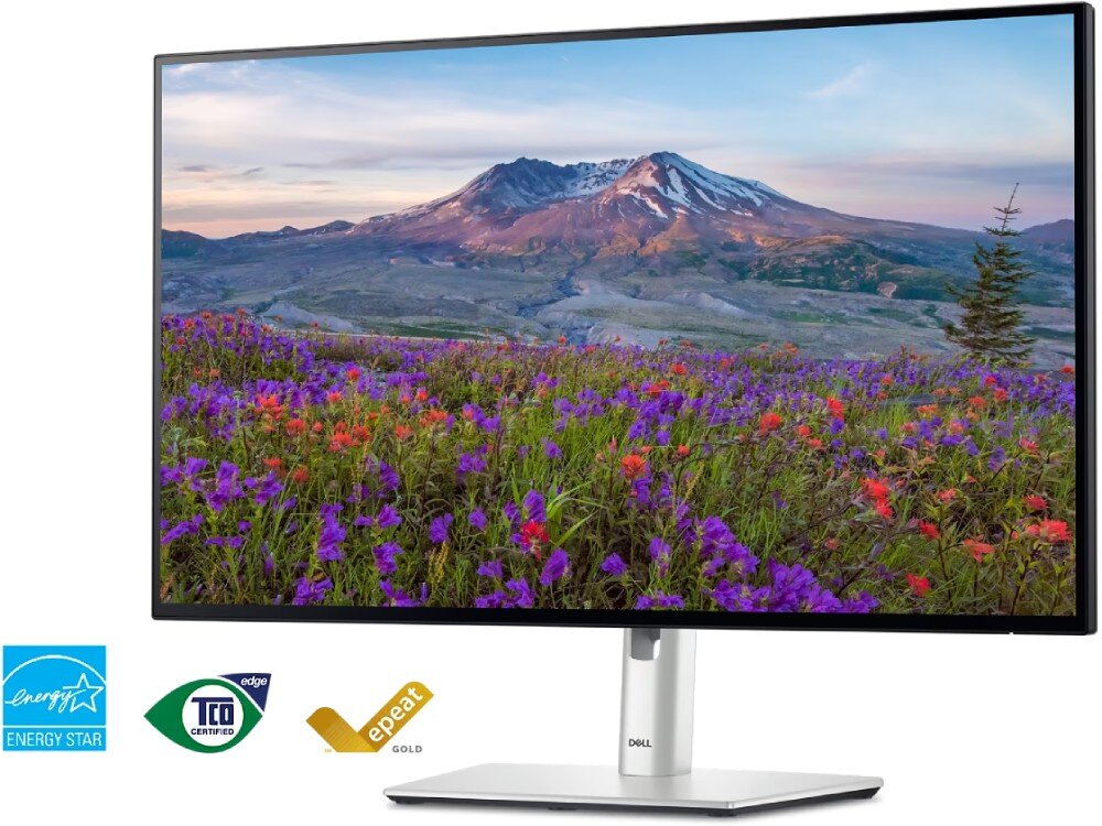 Monitor z wyświetlaczem przedstawiającym krajobraz górski z kwiatami na pierwszym planie. Widoczne są logotypy: Energy Star, TCO Certified, EPEAT Gold.